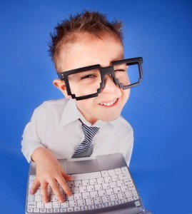 Five years old boy with a laptop computer