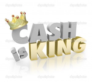 Cash is King with gold crown on the word to illustrate the buying power of currency or paper money vs credit
